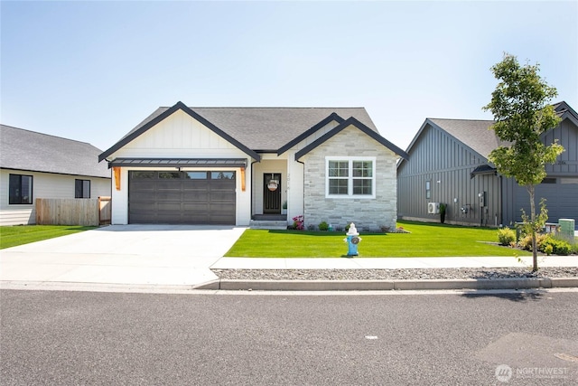 2016 Steelhead Way, Lynden, WA 98264 - modern inspired farmhouse with board and batten siding, an attached garage, driveway, and stone siding