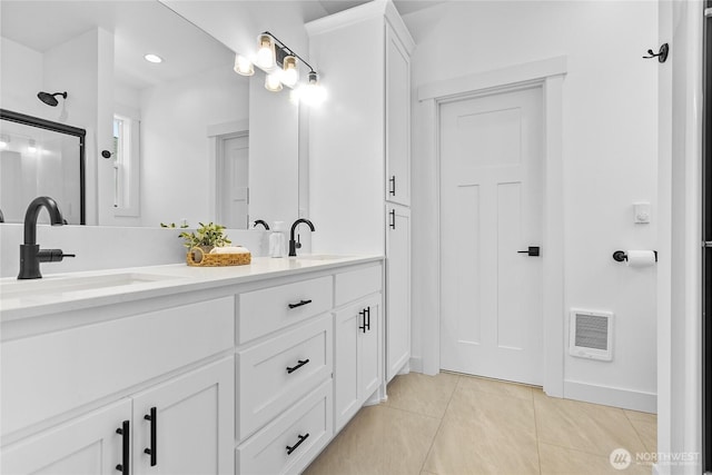2016 Steelhead Way, Lynden, WA 98264 - full bathroom featuring heating unit, double vanity, tile patterned flooring, baseboards, and recessed lighting