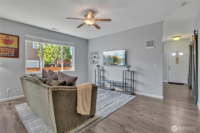28140 239th Ave SE, Maple Valley, WA 98038 - living area with a ceiling fan and wood finished floors