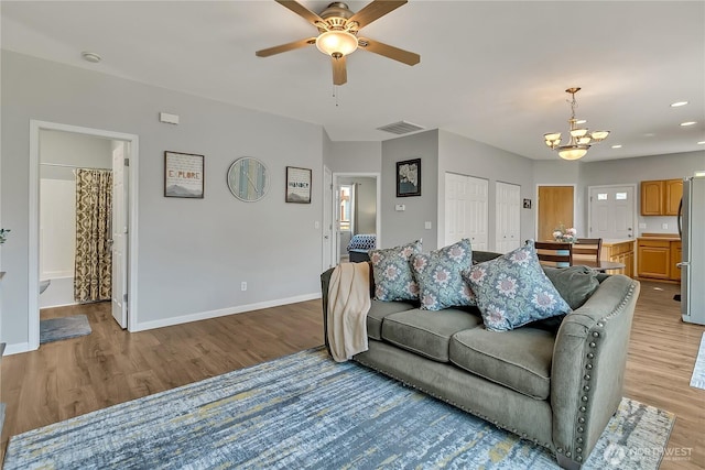 28140 239th Ave SE, Maple Valley, WA 98038 - living area with a chandelier, light wood finished floors, a ceiling fan, and recessed lighting