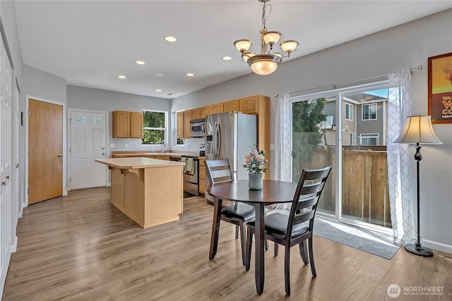 28140 239th Ave SE, Maple Valley, WA 98038 - dining space featuring light wood-type flooring, recessed lighting, and a chandelier