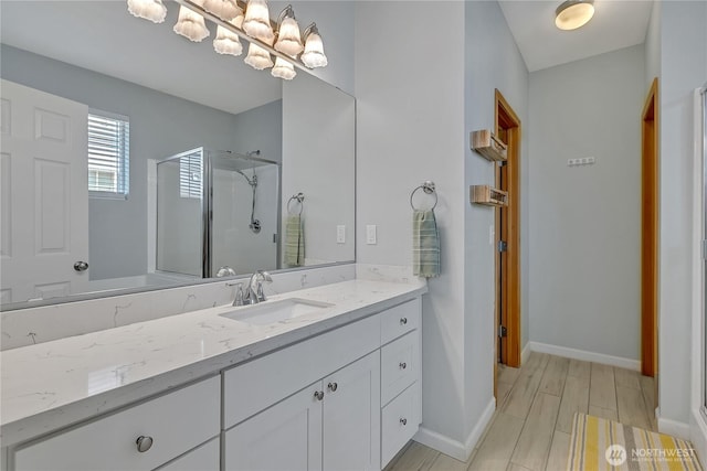 28140 239th Ave SE, Maple Valley, WA 98038 - full bathroom with vanity, a stall shower, and wood finished floors