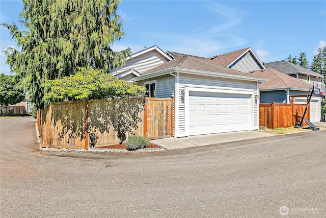 28140 239th Ave SE, Maple Valley, WA 98038 - ranch-style house with roof with shingles and an attached garage