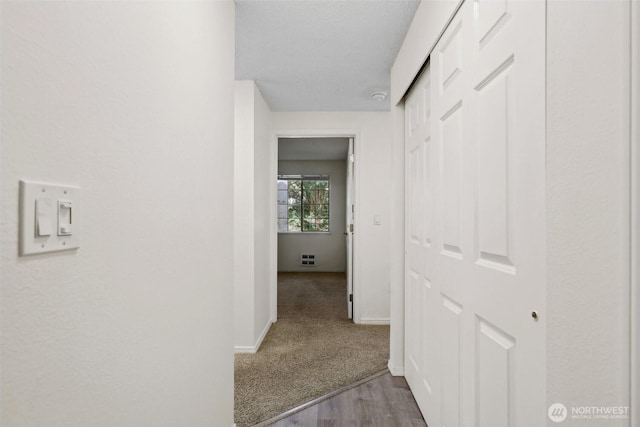 12515 NE 116th St Unit B23, Kirkland, WA 98034 - corridor featuring baseboards and wood finished floors