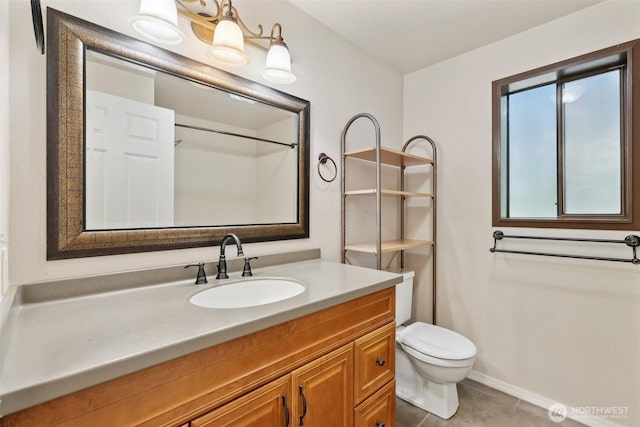 12515 NE 116th St Unit B23, Kirkland, WA 98034 - bathroom with toilet, vanity, tile patterned floors, baseboards, and a shower