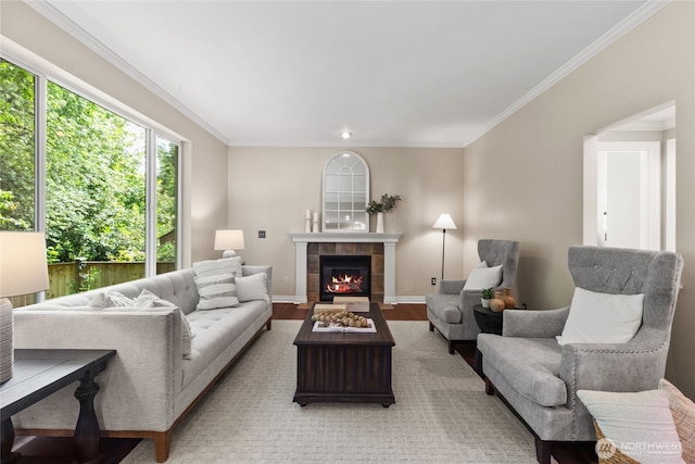 111 170th St SE, Bothell, WA 98012 - living room featuring ornamental molding, a tile fireplace, and light wood finished floors