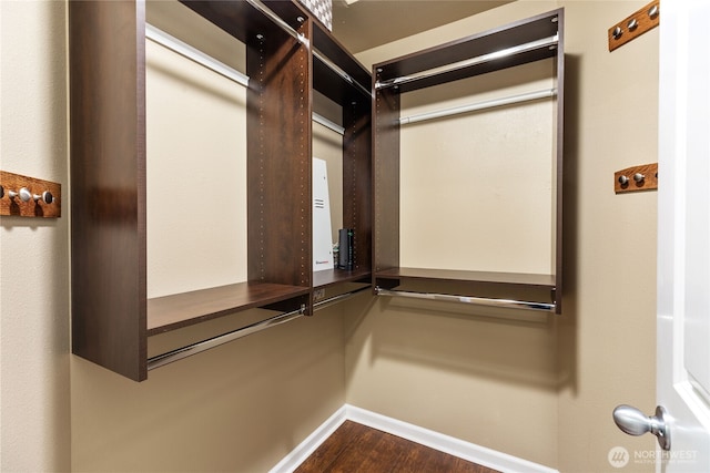 111 170th St SE, Bothell, WA 98012 - walk in closet featuring dark wood-type flooring