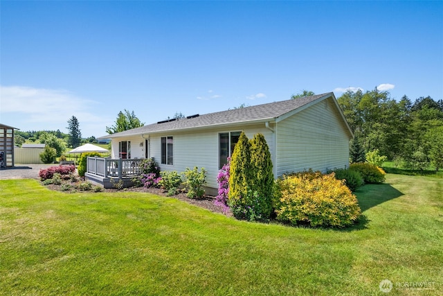 401 Huntting Rd, Silver Creek, WA 98585 - view of home's exterior featuring a wooden deck and a yard