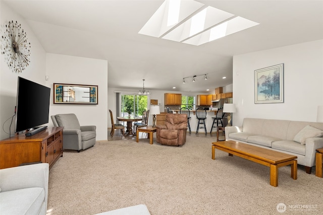401 Huntting Rd, Silver Creek, WA 98585 - living room featuring a skylight, light carpet, track lighting, and baseboards