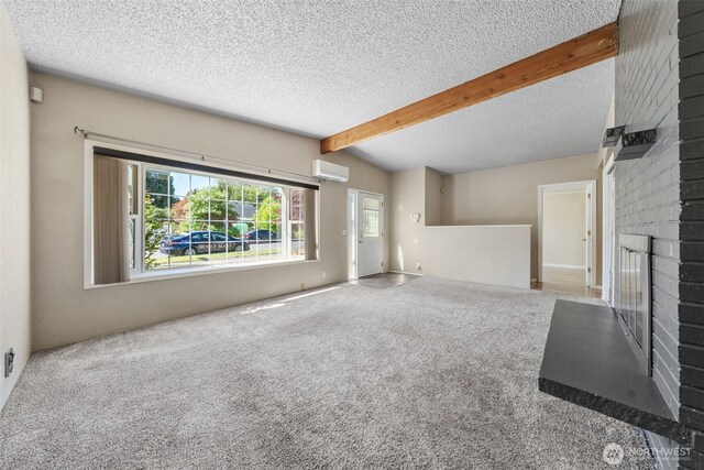 11401 69th Pl S, Seattle, WA 98178 - unfurnished living room featuring a fireplace, an AC wall unit, a textured ceiling, and carpet flooring