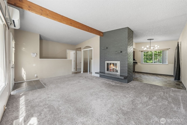 11401 69th Pl S, Seattle, WA 98178 - unfurnished living room with a wall unit AC, a fireplace, a textured ceiling, carpet floors, and beamed ceiling