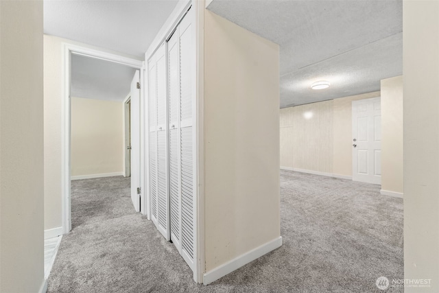 11401 69th Pl S, Seattle, WA 98178 - corridor featuring carpet floors, a textured ceiling, and baseboards
