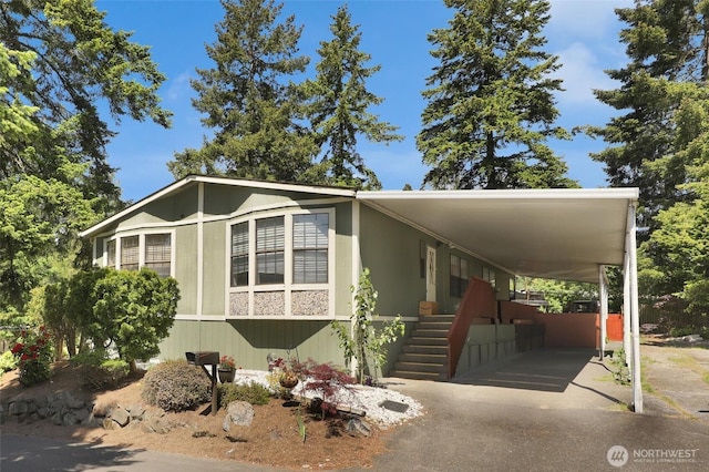 23708 Locust Way Unit 8B, Bothell, WA 98021 - manufactured / mobile home with stairs and a carport