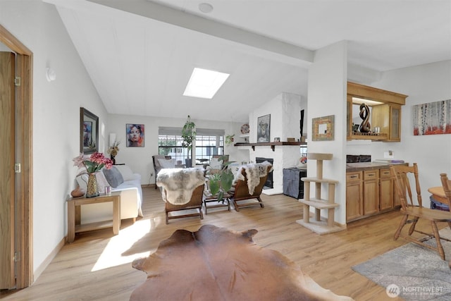 23708 Locust Way Unit 8B, Bothell, WA 98021 - dining area with vaulted ceiling, light wood-type flooring, and a skylight