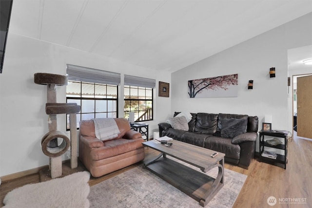 23708 Locust Way Unit 8B, Bothell, WA 98021 - living area with lofted ceiling, wood finished floors, and baseboards
