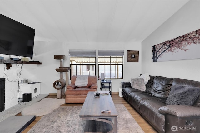 23708 Locust Way Unit 8B, Bothell, WA 98021 - living area with wood finished floors, lofted ceiling, and baseboards