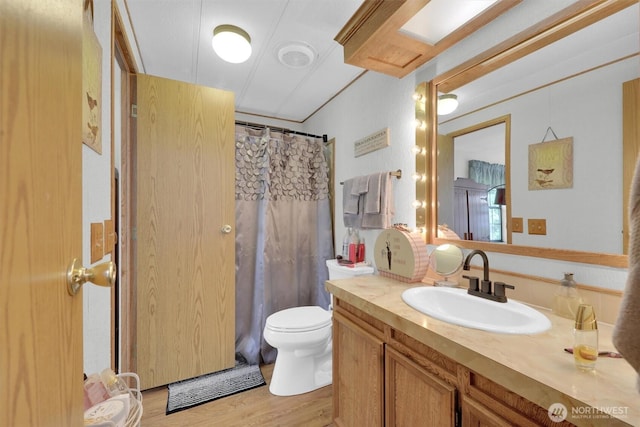 23708 Locust Way Unit 8B, Bothell, WA 98021 - bathroom with vanity, toilet, wood finished floors, and a shower with curtain