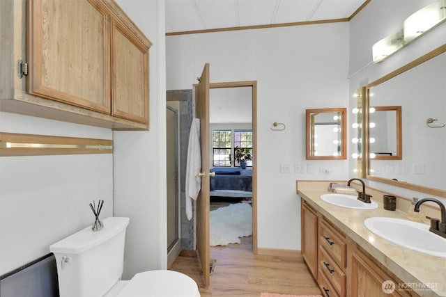23708 Locust Way Unit 8B, Bothell, WA 98021 - ensuite bathroom with toilet, double vanity, crown molding, wood finished floors, and an enclosed shower
