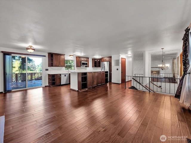 713 220th St SW, Bothell, WA 98021 - unfurnished living room featuring a chandelier and dark wood finished floors