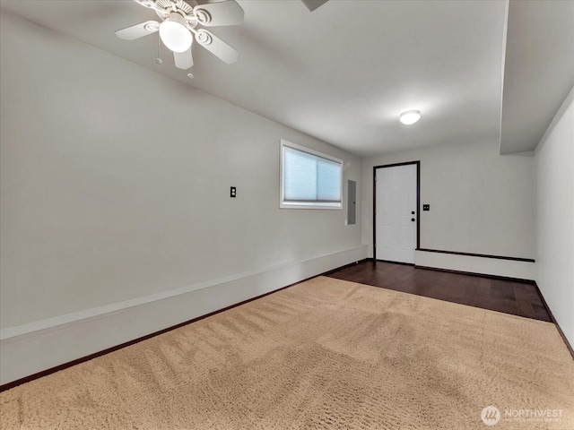 713 220th St SW, Bothell, WA 98021 - empty room with electric panel, ceiling fan, and dark wood-style flooring