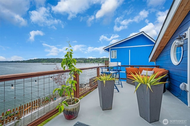 1811 Bay St, Port Orchard, WA 98366 - view of patio with an outdoor living space, a water view, and a balcony