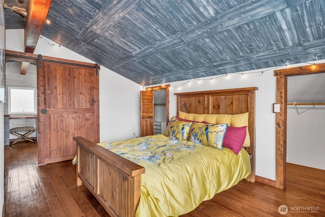 1811 Bay St, Port Orchard, WA 98366 - bedroom with wood-type flooring, a barn door, vaulted ceiling, and baseboards