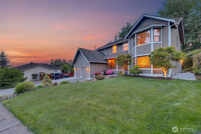 14937 104th Ave NE, Bothell, WA 98011 - view of front of property with a front yard, driveway, an attached garage, and a shingled roof
