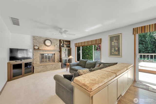 14937 104th Ave NE, Bothell, WA 98011 - living room with a ceiling fan, a large fireplace, and wood finished floors