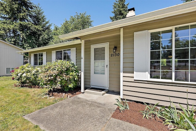 21301 118th Street Ct E, Bonney Lake, WA 98391 - property entrance featuring a chimney and a lawn