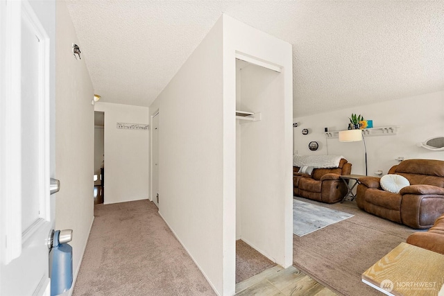 21301 118th Street Ct E, Bonney Lake, WA 98391 - corridor featuring a textured ceiling and light carpet