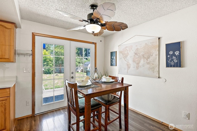 21301 118th Street Ct E, Bonney Lake, WA 98391 - dining room with french doors, a textured ceiling, dark wood finished floors, a ceiling fan, and baseboards