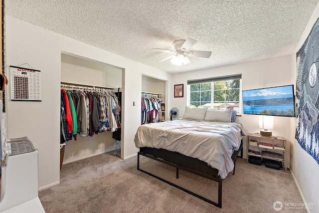21301 118th Street Ct E, Bonney Lake, WA 98391 - bedroom featuring carpet flooring, a textured ceiling, a ceiling fan, multiple closets, and baseboards