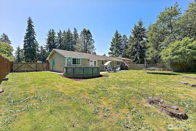 21301 118th Street Ct E, Bonney Lake, WA 98391 - back of house featuring a trampoline