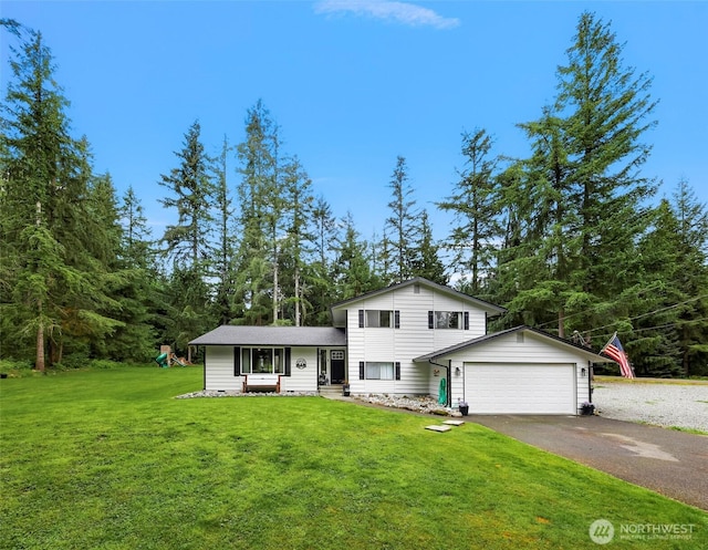 23059 Ida Ln, Sedro Woolley, WA 98284 - split level home featuring asphalt driveway, a garage, and a front lawn