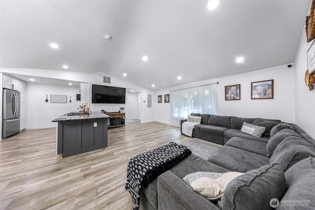23059 Ida Ln, Sedro Woolley, WA 98284 - living area featuring vaulted ceiling, light wood-style flooring, recessed lighting, and baseboards