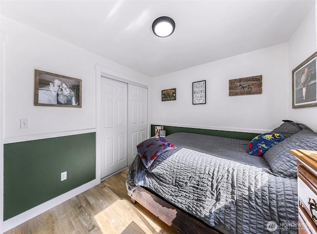23059 Ida Ln, Sedro Woolley, WA 98284 - bedroom with baseboards, wood finished floors, and a closet