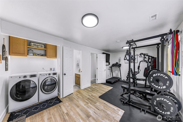 23059 Ida Ln, Sedro Woolley, WA 98284 - workout area with washing machine and dryer, light wood finished floors, and baseboards