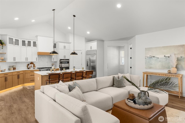 1516 131st Ave NE, Lake Stevens, WA 98258 - living area featuring light wood finished floors, recessed lighting, and high vaulted ceiling