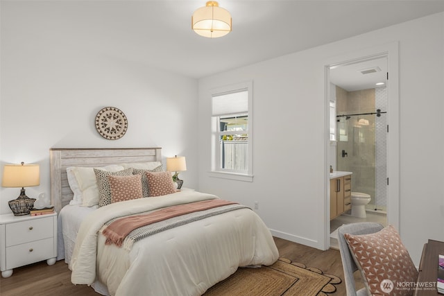1516 131st Ave NE, Lake Stevens, WA 98258 - bedroom featuring wood finished floors, connected bathroom, and baseboards