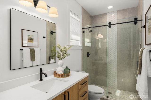 1516 131st Ave NE, Lake Stevens, WA 98258 - bathroom featuring vanity, toilet, and a stall shower