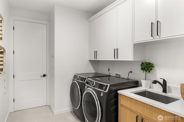 1516 131st Ave NE, Lake Stevens, WA 98258 - washroom featuring washing machine and clothes dryer, cabinet space, baseboards, and light floors