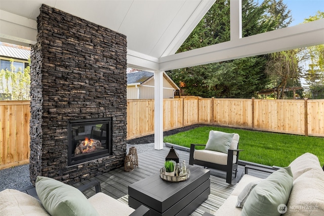 1516 131st Ave NE, Lake Stevens, WA 98258 - fenced backyard featuring an outdoor living space with a fireplace and a wooden deck