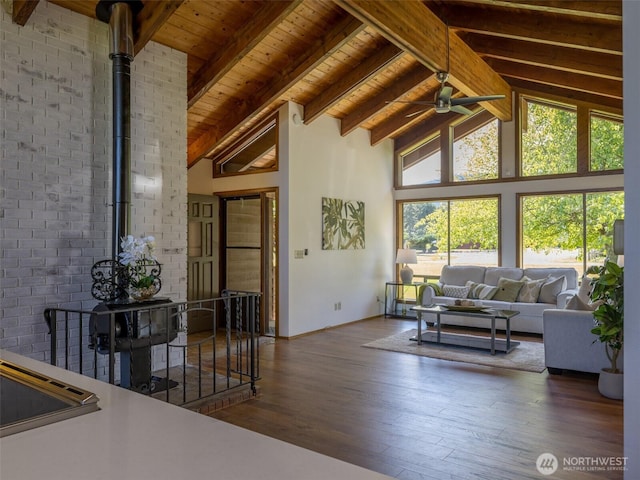 52 W Pheasant Ln, Sequim, WA 98382 - living room with high vaulted ceiling, a ceiling fan, baseboards, wood ceiling with exposed beams, and hardwood / wood-style flooring