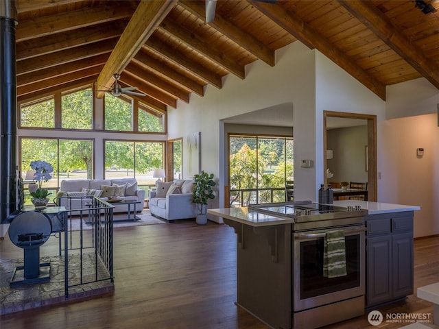 52 W Pheasant Ln, Sequim, WA 98382 - kitchen featuring stainless steel electric range, wood ceiling with exposed beams, a ceiling fan, open floor plan, and dark wood finished floors
