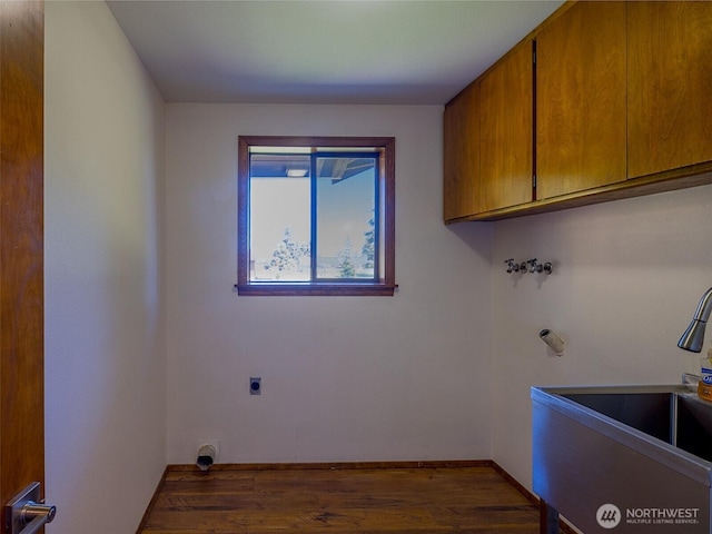52 W Pheasant Ln, Sequim, WA 98382 - laundry area featuring cabinet space, wood finished floors, electric dryer hookup, and baseboards