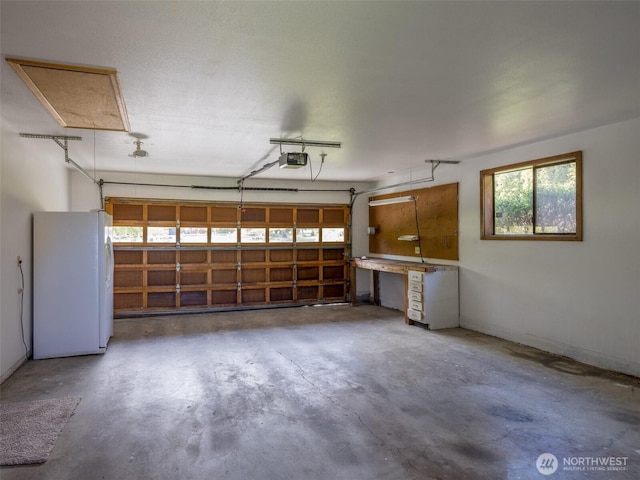 52 W Pheasant Ln, Sequim, WA 98382 - garage with freestanding refrigerator and a garage door opener