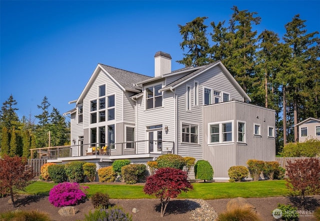 884 Saratoga Way, Camano Island, WA 98282 - back of house with a chimney, a lawn, a deck, and french doors