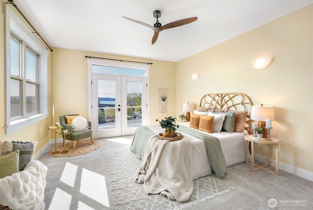 884 Saratoga Way, Camano Island, WA 98282 - carpeted bedroom featuring french doors, access to outside, multiple windows, and baseboards