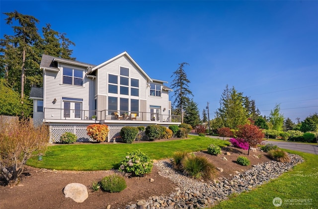 884 Saratoga Way, Camano Island, WA 98282 - back of house featuring a lawn and a deck