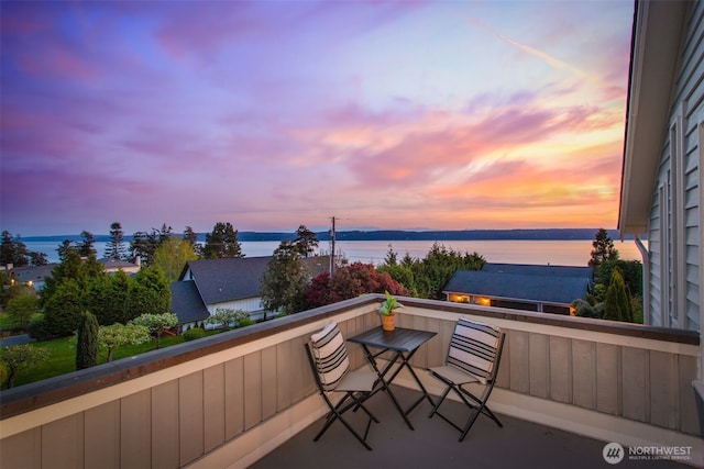 884 Saratoga Way, Camano Island, WA 98282 - balcony at dusk featuring a water view